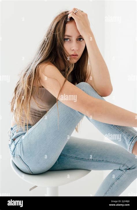 Studio Portrait Of Blonde Woman In Skinny Jeans Stock Photo Alamy