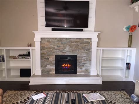 Mantel for electric fireplace insert. My husband built a mantel and shelves around an electric ...