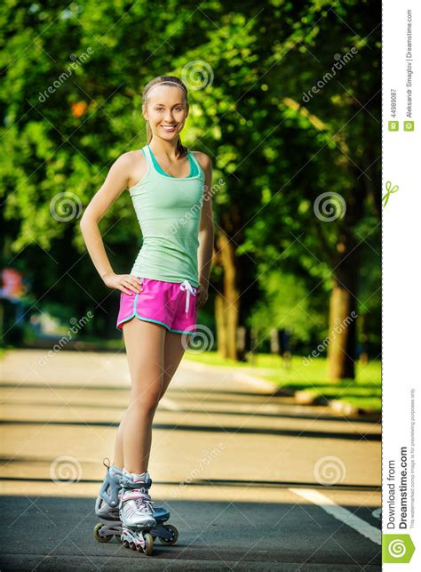 Rollerblading Woman Young Attractive Female Fitness Model Is Ha Stock
