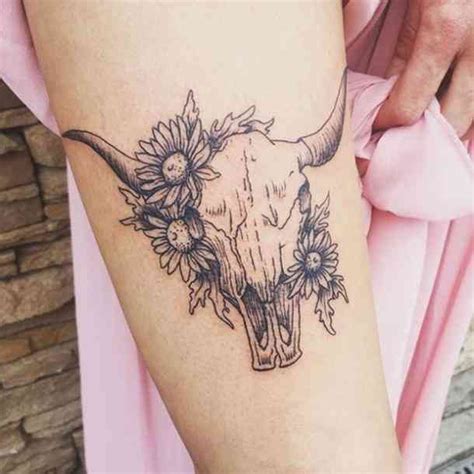 A Bull Skull Tattoo With Flowers On Forearm Taurus Zodiac