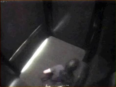 cctv woman piss lift elevator floor 01