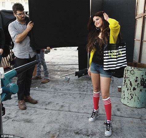 katching my i selena gomez makes trainers look sexy as she models her clothing collection for