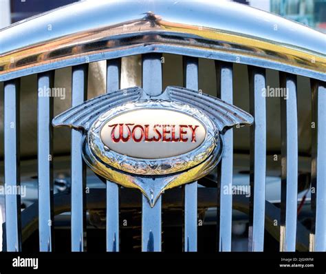 Close Up Of Classic Illuminated Grill Badge On Vintage Wolseley Car