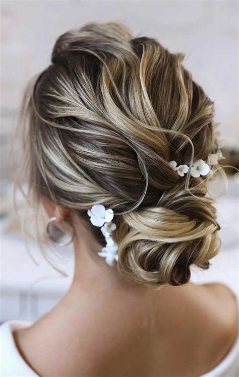 Updos have a bit of a stodgy reputation, but as celebrities often prove on the red carpet, that doesn't have the be the case. 100 Best wedding hairstyles updo for every length