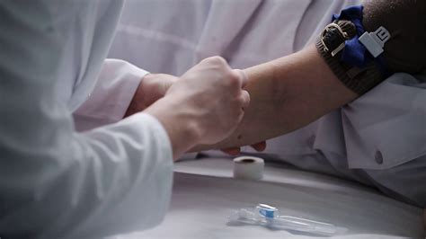 The Doctor Treats Patients Arm For Injection Stock Video Footage 0037