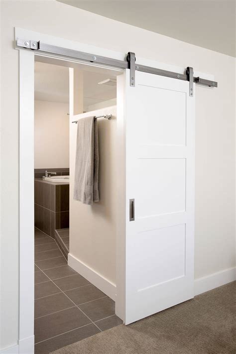 Sliding Barn Door In Gray To The Bedroom