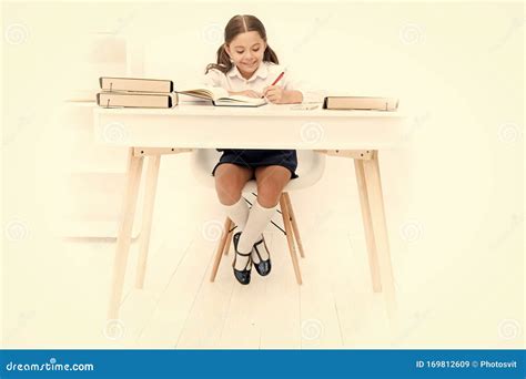 What Should Be Height Of Study Table Schoolgirl Doing Homework At