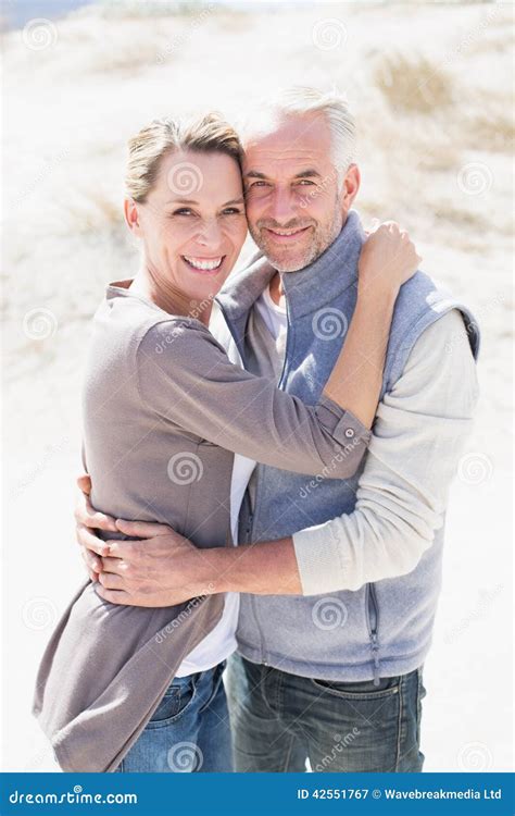 Happy Hugging Couple On The Beach Looking At Camera Stock Image Image