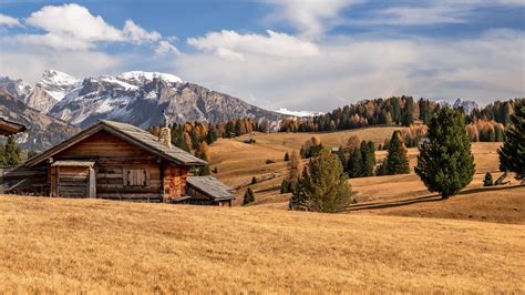 Wooden House In The Dolomite Mountains Wallpaper Backiee
