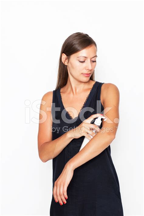 Attractive Woman Putting Lotion On Her Body Stock Photo Royalty Free Freeimages