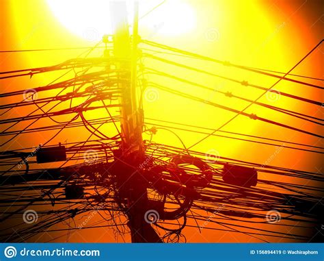 Incredible Tangle Of Electric Cables On Yellow Sky In Bangkok Thailand
