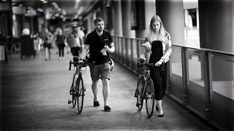 Black And White Of Two People Walking Their Bikes Image Free Stock