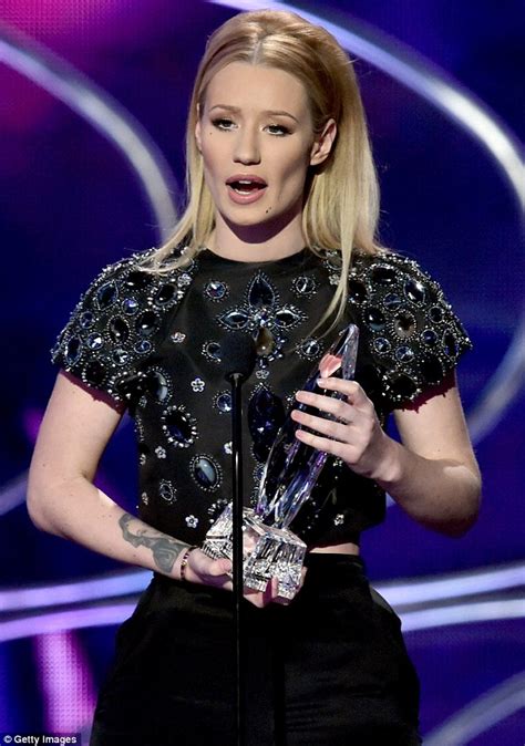 Iggy Azalea Shows Off Her Curves As She Performs In Clinging White At