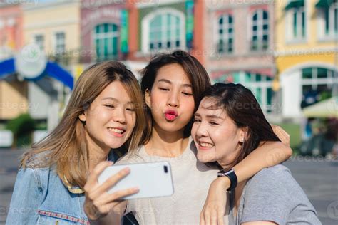 Attractive Beautiful Asian Friends Women Using A Smartphone Happy
