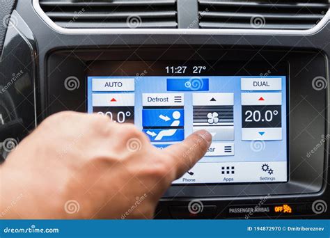 The Male Driver Controls The Settings Of The Car Air Conditioning