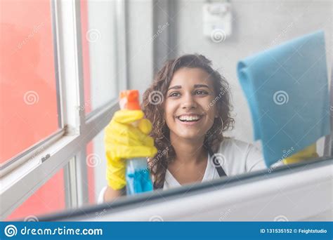 People Housework And Housekeeping Concept Happy Woman In Gloves Cleaning Window With Rag And
