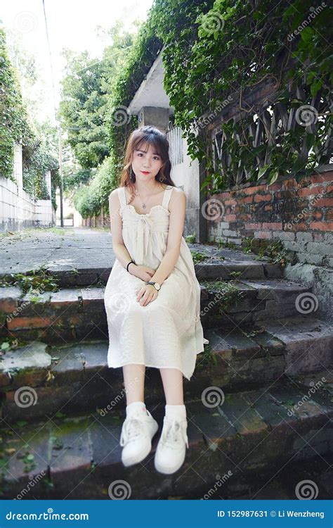 Beautiful And Lovely Asian Girl Shows Her Youth In The Park Stock Image