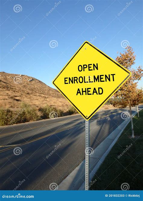 Yellow Diamond Road Sign Announcing Open Enrollment Ahead Stock Image