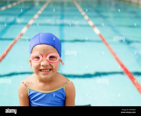 Girl Wearing Swimming Goggles By Pool Portrait Stock Photo Alamy