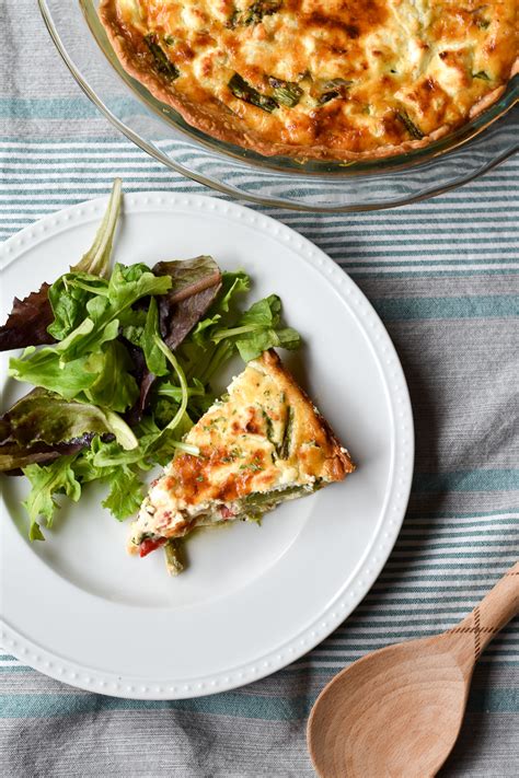 Asparagus Goat Cheese And Roasted Red Pepper Quiche With Two Spoons