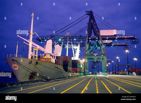 A Docked Cargo Ship And Loading Cranes Stock Photo Alamy