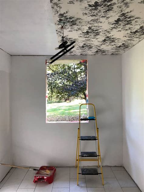 Unfurl wallpaper approximately 6 longer in width than the ceiling itself, then cut to size using utility first, apply an even coat of wallpaper paste for the next run. Smoky Rose Floral Wallpapered Ceiling in the Mudroom