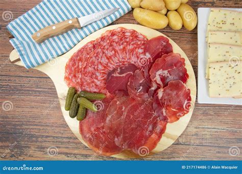 Raclette Cheese And Cold Cuts On A Table Stock Photo Image Of Sausage