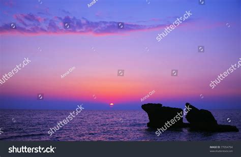 Beautiful Purple Sunset On The Beach Seascape With Calm