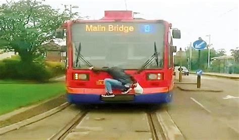 Man Goes To Extreme Lengths To Dodge Fare By Clinging To The Back Of