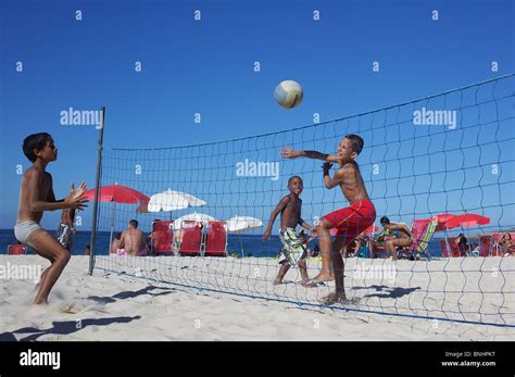 Young Children Play Beach Volleyball At Copacabana Beach Rio De