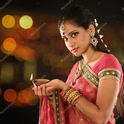 Indian Girl Hands Holding Diya Lights Stock Photo By ©szefei 82682126