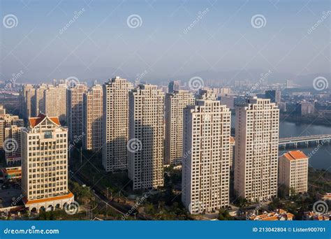 Aerial View Of Modern City Skyline Beside The River At Sunrise In Jimei