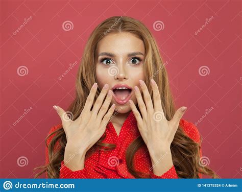 Beautiful Young Excited Surprised Woman With Opened Mouth On Colorful Bright Pink Background