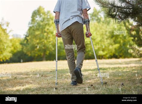 Senior Man Walking On Crutches Hi Res Stock Photography And Images Alamy