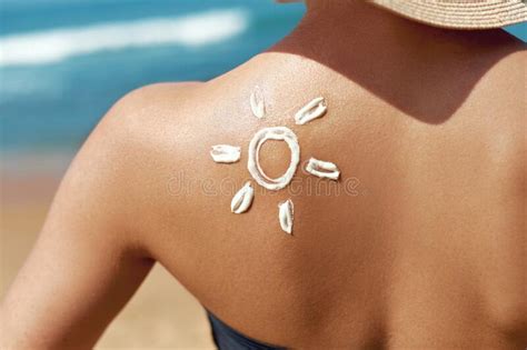 Woman Applying Sun Cream On Tanned Shoulder In Form Of The Sun Sun Protectionsun Cream Skin