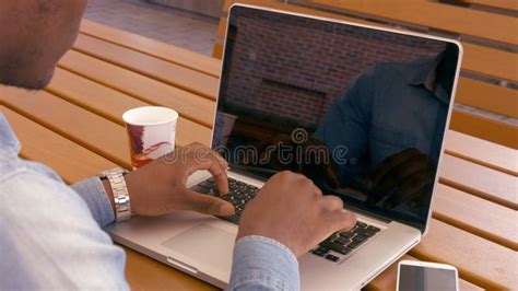 Over The Shoulder Shot Of Couple Looking At Tablet With Green Screen