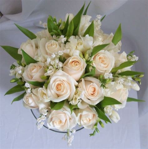 Pale Bridal Bouquet Of Roses Freesias And Lily Of The Valley Lily