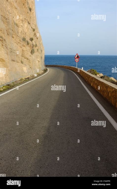 Scenic Road With A Landslide Warning Sign Stock Photo Alamy