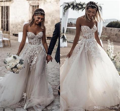 Whether it's an intimate beach wedding or twirling under glowing lights, our newest gowns, sprinkled with sparkling beads and dramatic trains, are ready for a celebration of love. 21 Best Beach Wedding Dresses For 2019/2020 - Royal Wedding