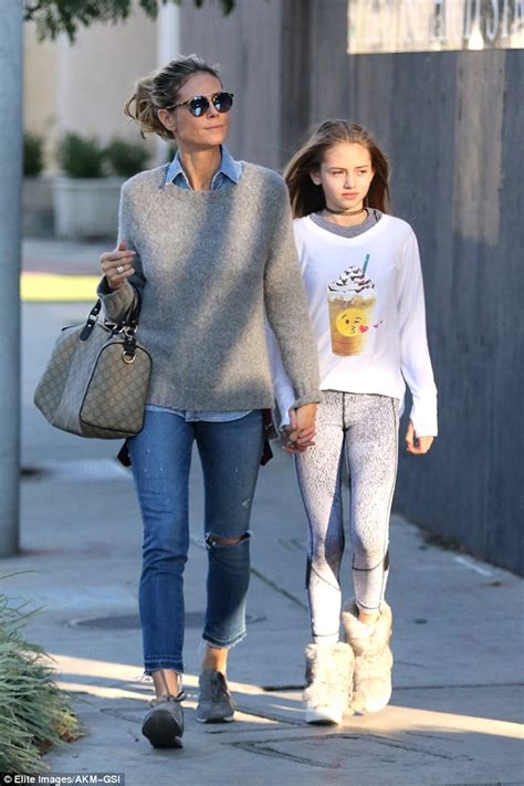 Ernsthafte konkurrenz aus der eigenen familie: Heidi Klum rocks ripped blue jeans as she hits the shops ...