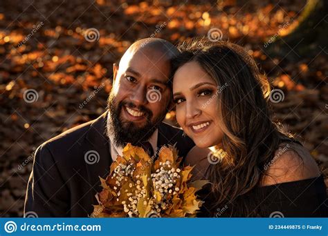 Romantic Photo Of A Well Dressed Mixed Race Couple Hugging And Holding