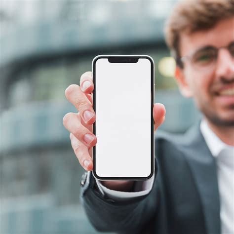 Free Photo Portrait Of A Businessman Showing White Screen Mobile