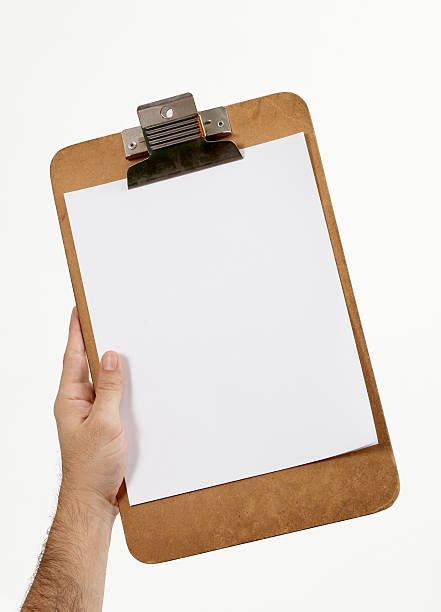 Hand Holding Clipboard Stock Photos Pictures And Royalty Free Images
