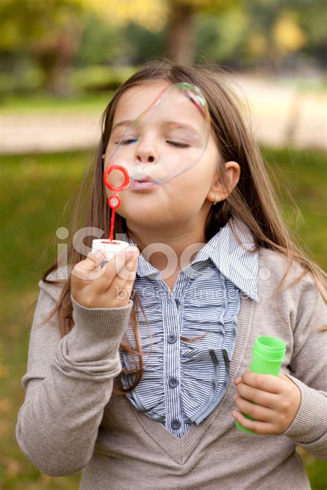 Girl Blowing Bubbles Stock Photo Royalty Free Freeimages