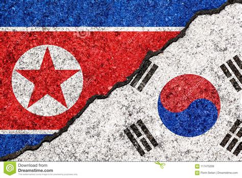 Flags Of South Korea And North Korea Painted On Cracked Wall Background