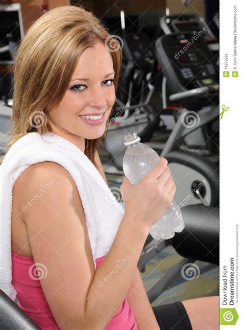 Woman With Bottled Water At The Gym Royalty Free Stock