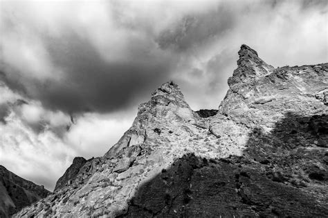 Majestic Rough Rocky Cliffs Under Stormy Sky · Free Stock Photo