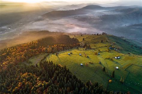 Bucovina Autumn Sunrise Landscape In Romania With Mist And Mountains