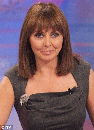 Carol Vorderman Distracts From Her New Blonde Do As She Pours Herself