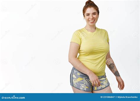 Portrait Of Smiling Chubby Redhead Girl Workout In Gym Standing In